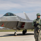 A U.S. military policeman stands in front of a U.S. Air Force F-22 Raptor fighter jet at the Siauliai airbase, some 230 km (144 miles) east of the capital Vilnius, Lithuania, Wednesday, April 27, 2016. Two US F-22 fighter, which are part of the Operation Atlantic Resolve, a U.S. commitment to NATO’s collective security and regional stability, arrived from their base in Britain as a show of force to help Baltic members protect their borders with Russia. (AP Photo/Mindaugas Kulbis)